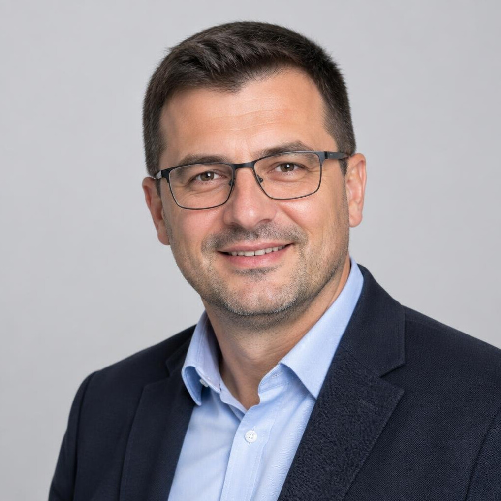 Portrait of a man with glasses smiling