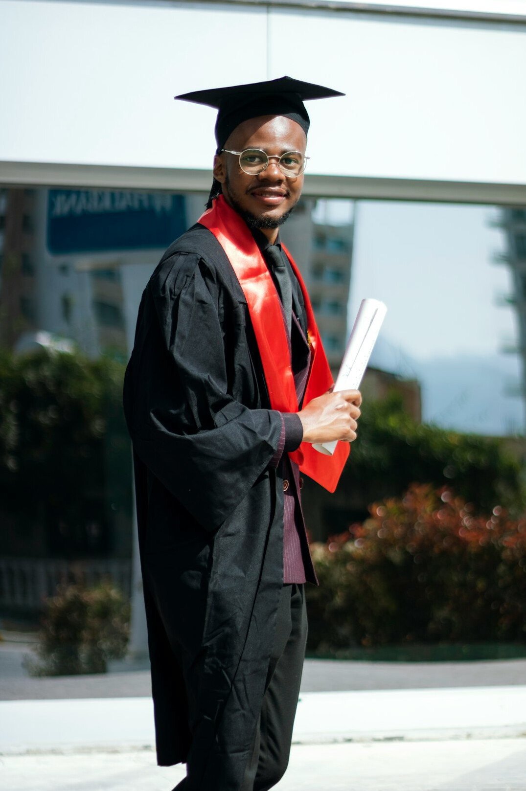 happy graduate holding certificate